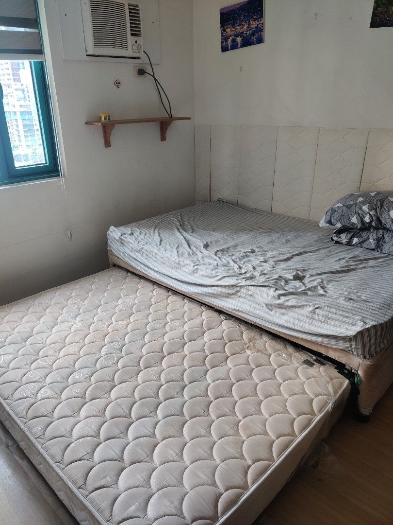 Double Bed with Pullout (Category: Bed Frames & Mattresses) located in Pasig City. Submitted by indigo.j (Listing ID 1461826097, Image 1). Description: - Mattress with patterned cover - Ideal for small spaces - Price is negotiable - 50 x 78 inches - Pickup only.