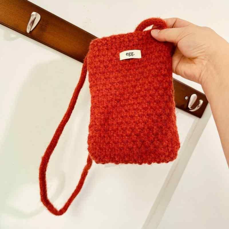 Egg. Knitted Phone Pouch Bag (Category: Purses & Pouches) located in La Trinidad. Submitted by whatnotcollections (Listing ID 1461923920, Image 2). Description: - Cute knitted pouch from the brand 'Egg'. - Designed to be worn crossbody with a long strap. - Perfectly fits a phone. - Ideal for keeping your phone easily accessible. - Features a lovely knit texture..