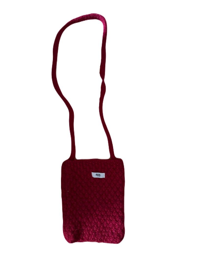 Egg. Knitted Phone Pouch Bag (Category: Purses & Pouches) located in La Trinidad. Submitted by whatnotcollections (Listing ID 1461923920, Image 3). Description: - Cute knitted pouch from the brand 'Egg'. - Designed to be worn crossbody with a long strap. - Perfectly fits a phone. - Ideal for keeping your phone easily accessible. - Features a lovely knit texture..