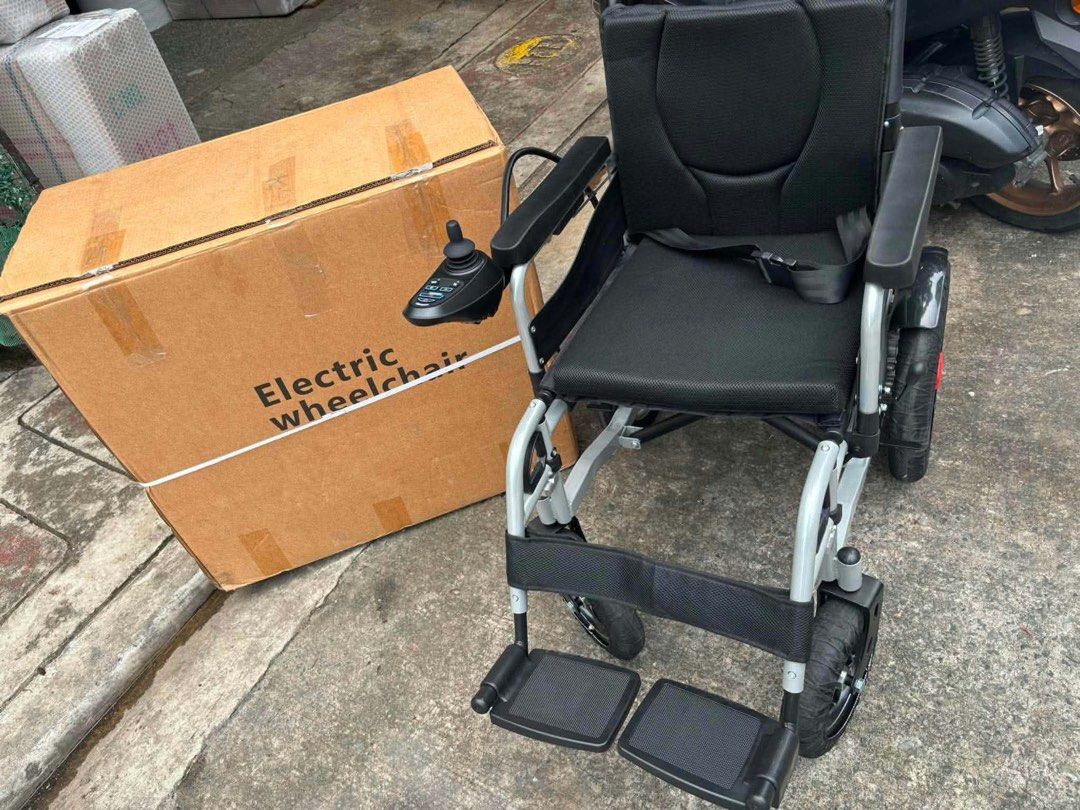 Electric Wheelchair - Foldable Mobility Aid (Category: Wheelchairs) located in Manila. Submitted by rosel2001 (Listing ID 1461828476, Image 1). Description: - Electric wheelchair, ready for immediate use. - Folds easily for convenient transport and storage. - Equipped with safety armrests and a secure seatbelt. - User-friendly joystick controller located on the right armrest. - Sturdy and reliable wheels for smooth mobility. - Original box includ