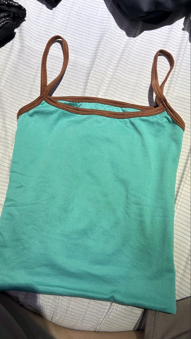 Fhilar Choco Brown Top (Category: Sleeveless) located in Caloocan City. Submitted by mariettani10615 (Listing ID 1461990912, Image 1). Description: Never been use, size small. rfs: wrong color nabili - Cute teal tank top - Features brown trim around neckline and straps - Stretchy material for a comfortable fit - Versatile: perfect for layering or wearing solo - Simple and casual design.