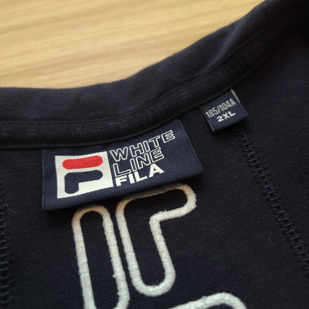 Fila White Line Navy Track Jacket 2XL (Category: Coats, Jackets and Outerwear) located in Quezon City. Submitted by mofinds.ph (Listing ID 1461908646, Image 3). Description: Size: XXL Dimes: 24x29 Condition: Excellent/Great condition MOP: BPI DELIVER: LALAMOVE OR J&T MEETUP/PICKUP: Victoria Tower D, Mother Ignacia Ave., Brgy. Paligsahan, Diliman, Quezon City.