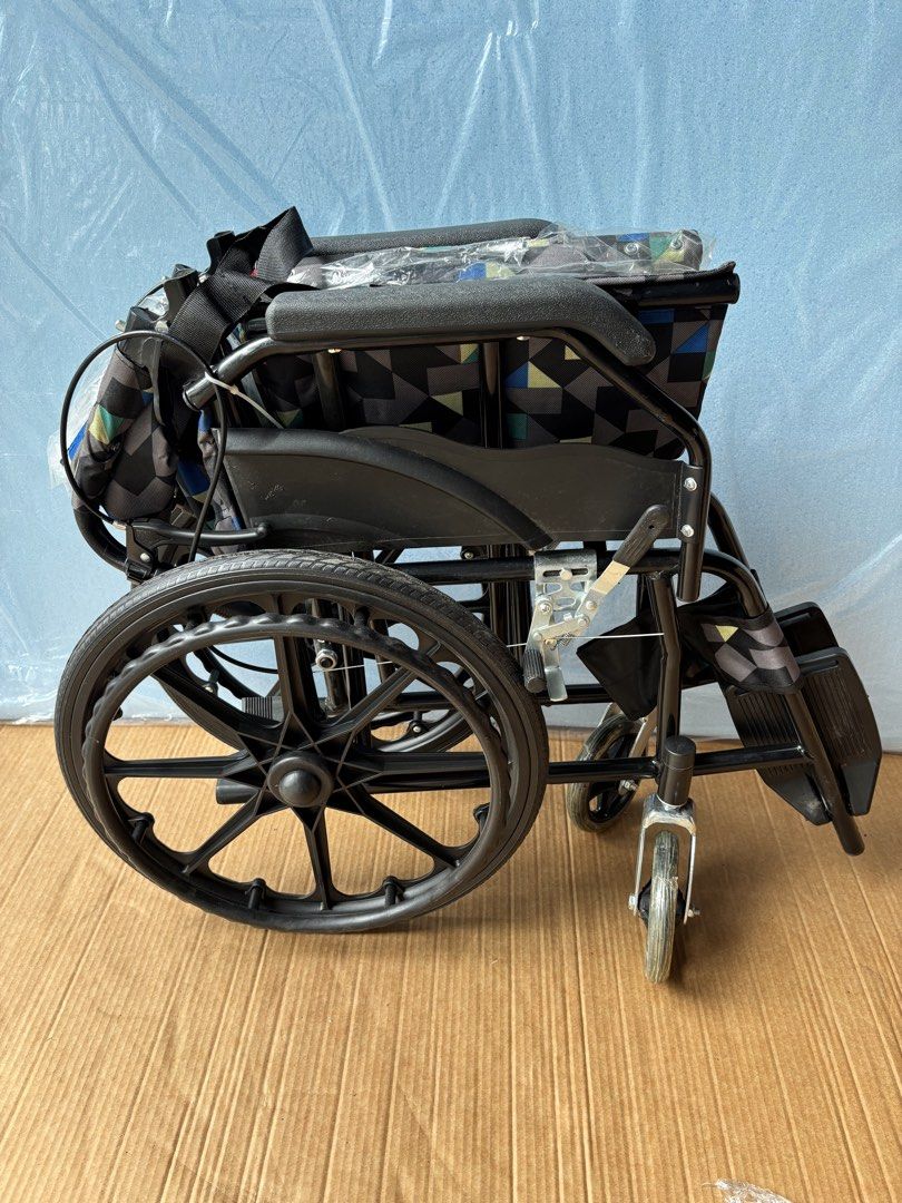 Folding Wheelchair with Patterned Seat and Backrest (Category: Wheelchairs) located in Manila. Submitted by rosel2001 (Listing ID 1461829613, Image 3). Description: - Lightweight and foldable for easy transport and storage. - Comfortable seat and backrest with a stylish geometric pattern. - Equipped with armrests and footrests for added support. - Safety belt included for secure use. - Ready for its next owner..