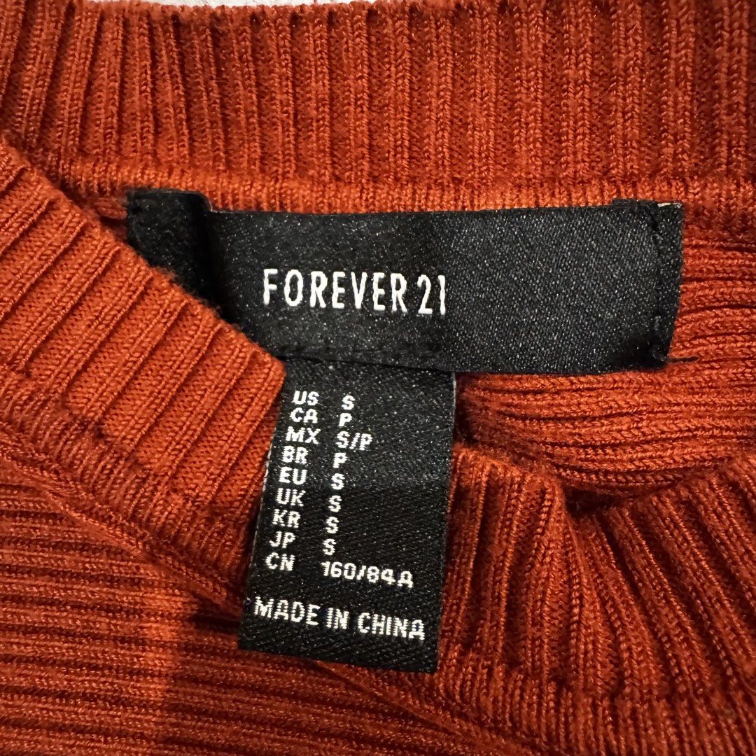 Forever 21 rust sweater (Category: Longsleeves) located in Muntinlupa City. Submitted by champange101 (Listing ID 1461847230, Image 2). Description: Pre loved! No issues. Size is in the photo No when worn photos.