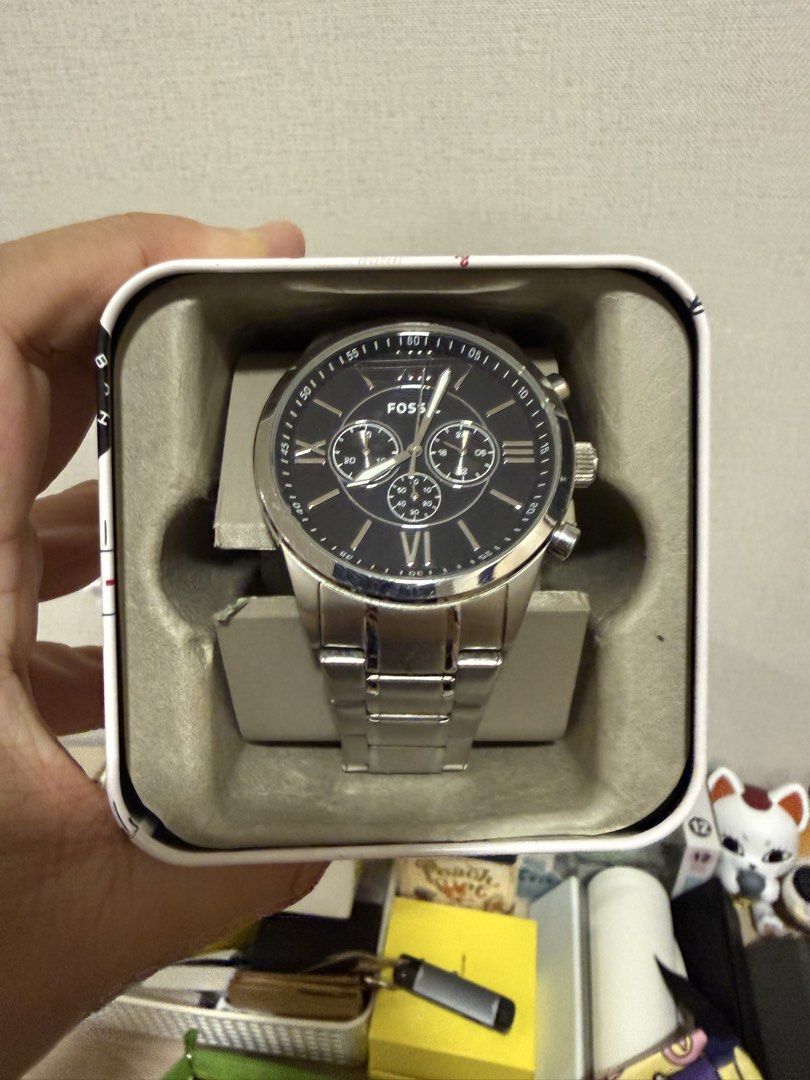 Fossil Chronograph Watch (Category: Men's Watches) located in Mandaue City. Submitted by ecthelionv2 (Listing ID 1461840361, Image 2). Description: - Fossil Watch - Black Dial - Stainless Steel Band & Casing - Chronograph Function with 3 Sub-dials - Roman Numeral at 6 o'clock - Includes Original Fossil Tin - Versatile for Casual or Formal Wear.