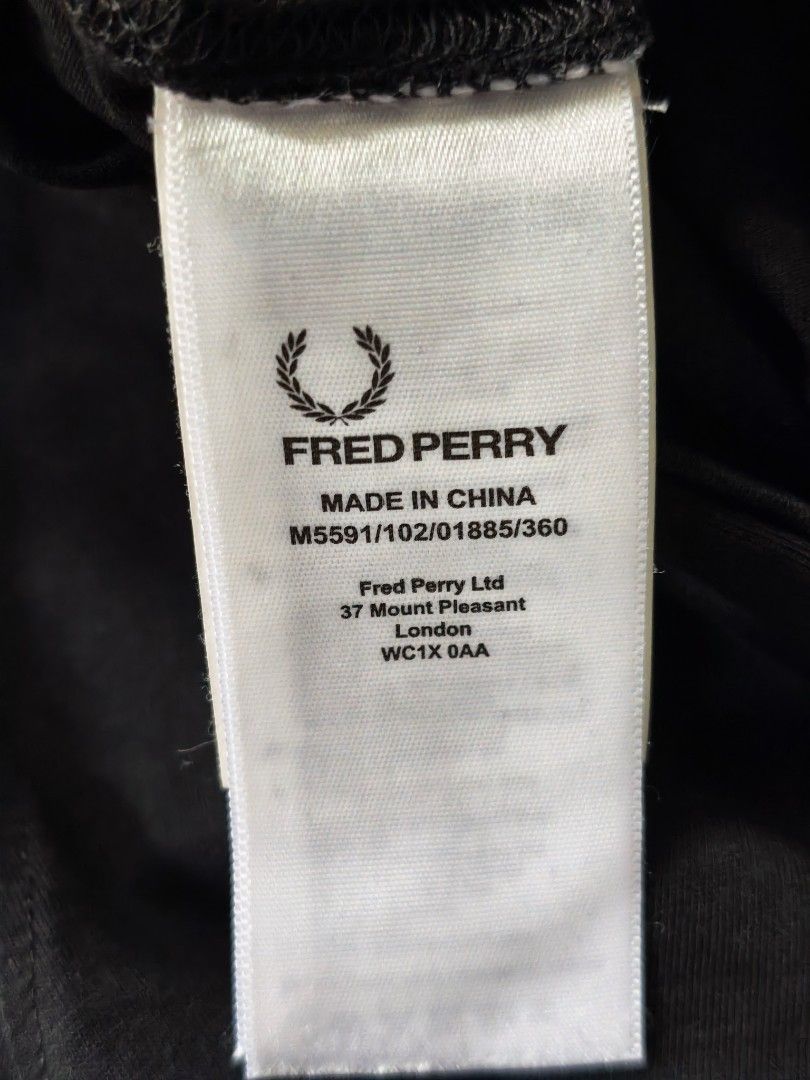 Fred Perry Black T-Shirt Size L (Category: Tshirts & Polo Shirts ) located in Quezon City. Submitted by rezno (Listing ID 1462016392, Image 3). Description: - Brand: Fred Perry - Color: Black - Size: XL (Tag) - Measurements: 22 inches (width) x 28 inches (length) - Material: 100% Cotton - Features: Iconic black laurel wreath logo - Style: Simple, classic, versatile staple piece.