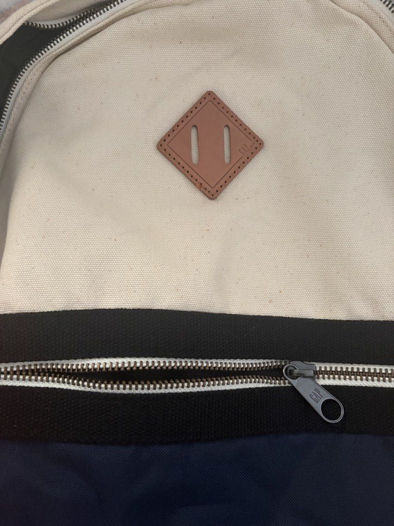 GAP Colorblock Canvas Backpack Cream Orange Navy (Category: Backpacks) located in Paranaque City. Submitted by max_bully014 (Listing ID 1461843958, Image 3). Description: - Classic GAP colorblock backpack - Colors: Cream, orange, and navy panels - Material: Durable canvas - Features: Zippered main compartment and front pocket - Adjustable shoulder straps for comfort - Perfect for school or everyday adventures.