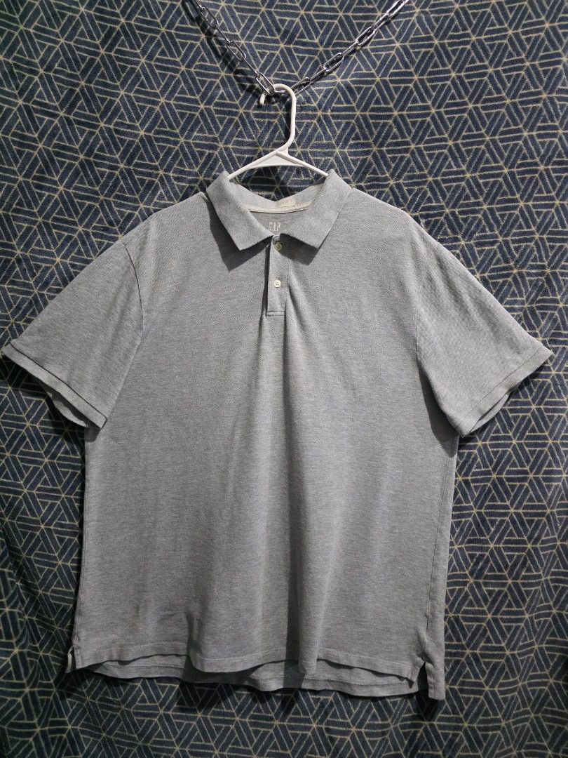 GAP Men's Grey Polo Shirt (Category: Tshirts & Polo Shirts ) located in Quezon City. Submitted by kick_mnl (Listing ID 1461870814, Image 1). Description: Grey polo shirt from GAP. Short sleeves, collared with two buttons. Made from cotton and spandex blend. Tag says XL, fits 50-52 / 97-102cm. Great for casual wear or a smart casual look. Easy to pair with jeans or shorts..