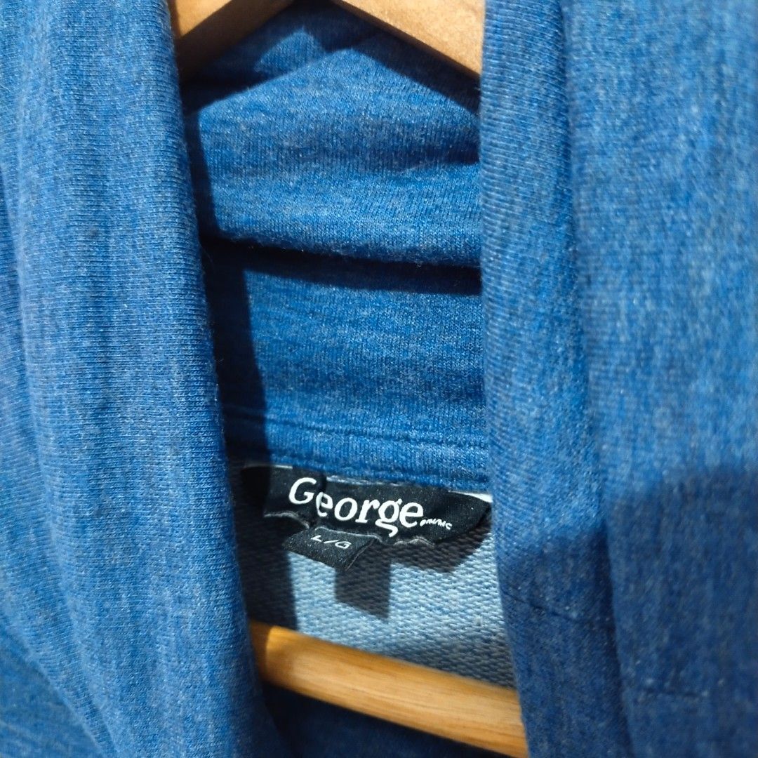 George Cowl Neck Asymmetrical Pullover (Blue/Heather Denim) (Category: Longsleeves) located in Subic. Submitted by mustardt_ (Listing ID 1461852476, Image 3). Description: A blue heather-knit long-sleeve top featuring a cozy cowl/funnel neck, an asymmetrical wrapped front hem, and thumbholes on the cuffs. size: 23in x 24in code: c735.