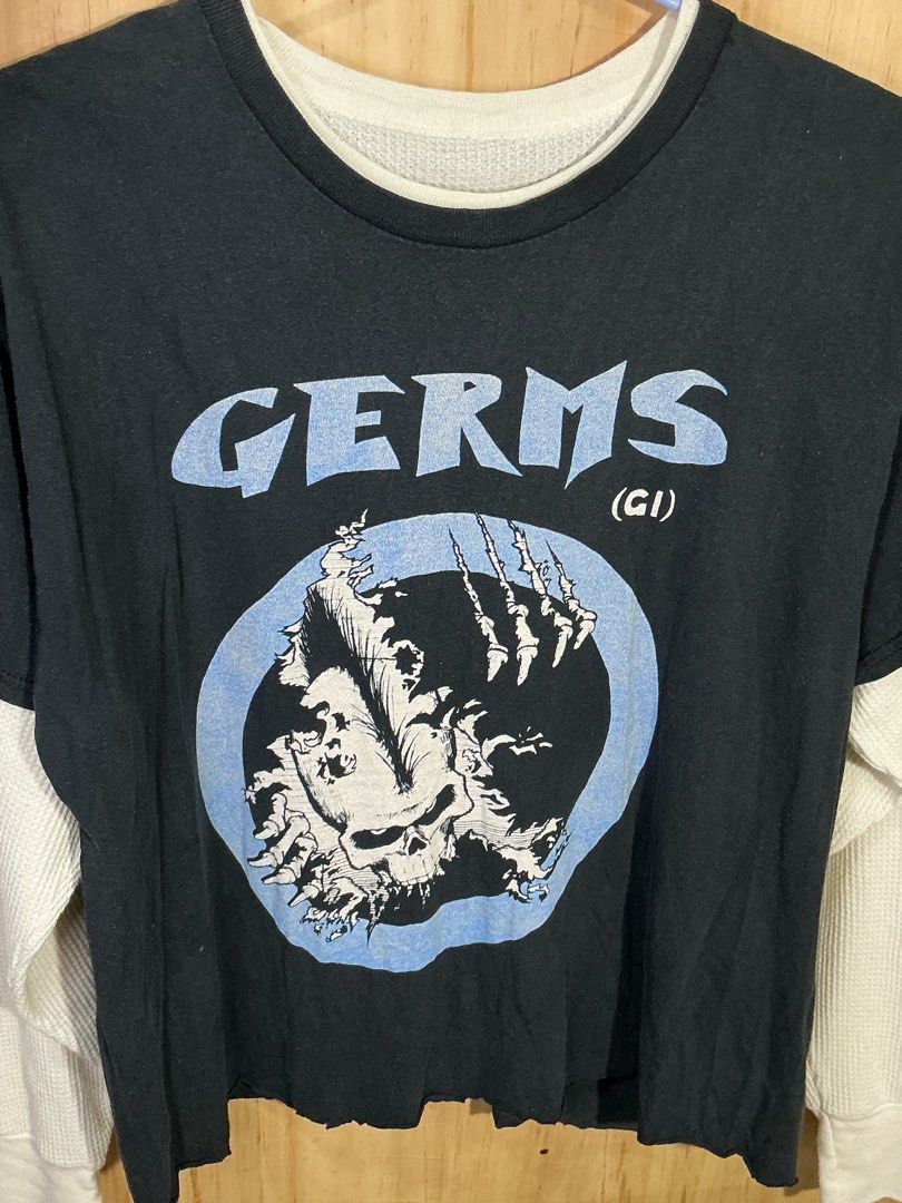 GERMS (GI) Double Layer Long Sleeve T-Shirt (Category: Tshirts & Polo Shirts ) located in Naga. Submitted by eunhasowon12391 (Listing ID 1461826215, Image 2). Description: - Black t-shirt with 'GERMS' band graphic print - Layered look with white long sleeves underneath - Raw hem for a edgy, punk rock style - Perfect for a cool, casual vibe.