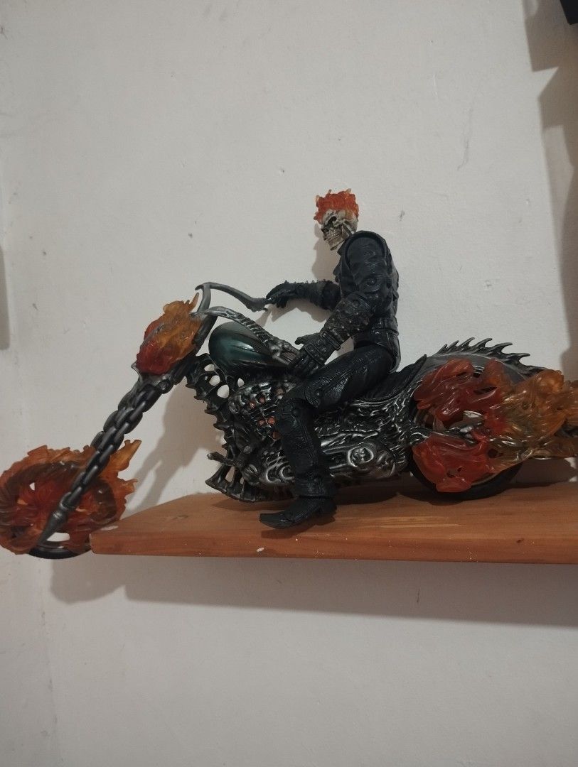 Ghost Rider Motorcycle Action Figure Toy (Category: Figurines & Statues) located in Taguig. Submitted by weapon.x (Listing ID 1461859494, Image 2). Description: - Iconic Ghost Rider action figure - Rides a detailed flaming motorcycle - Figure features a skull face and leather jacket - Motorcycle has fiery accents and a chain - Excellent collectible and display piece for fans - nego if kukunin now .
