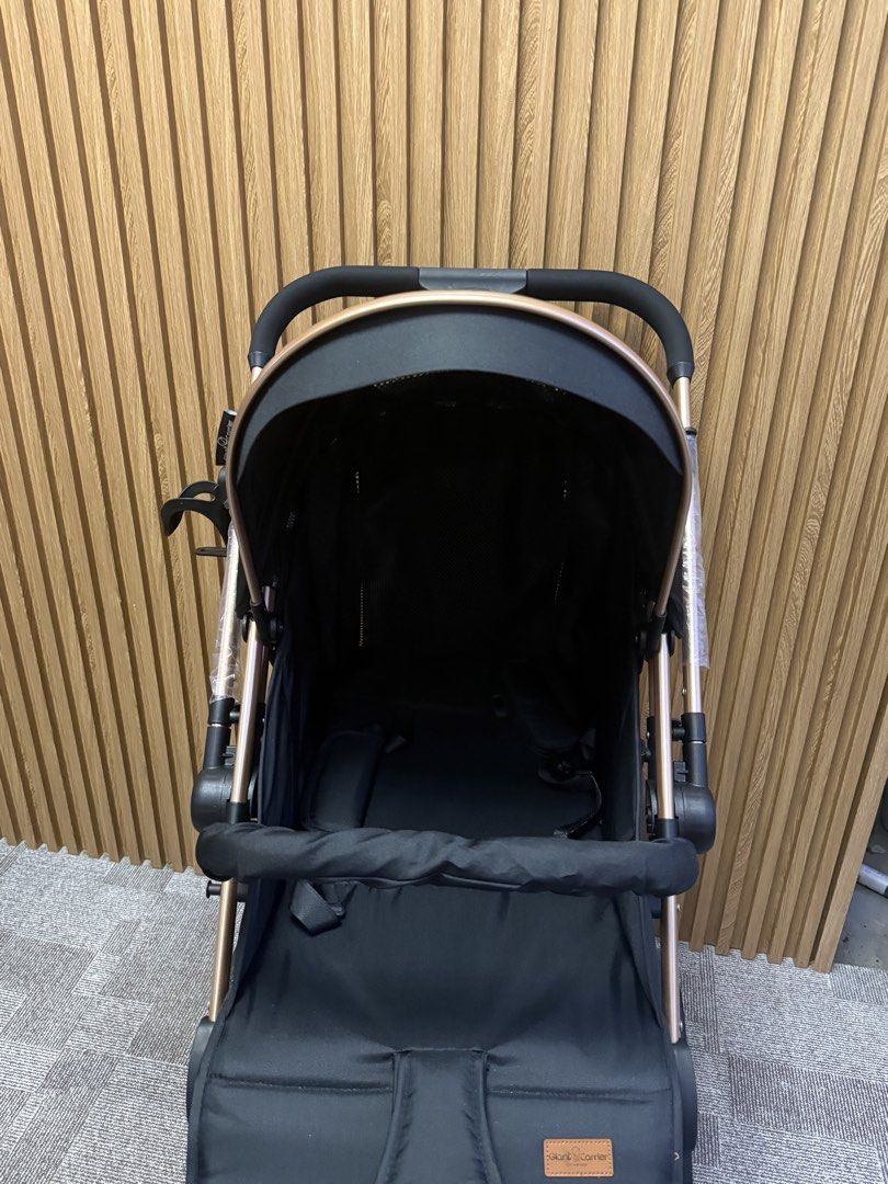 Giant Carrier Stroller - Iker Black & Rose Gold (Category: Strollers) located in Angeles City. Submitted by nutella_crepe_2026 (Listing ID 1461905587, Image 2). Description: - Chic black stroller with a luxurious rose gold frame. - Includes a protective canopy and a secure safety harness. - Convenient storage basket for essentials. - Effortless maneuverability to swivel wheels. - Compact design for easy storage. - Ideal for stress-free outings wi