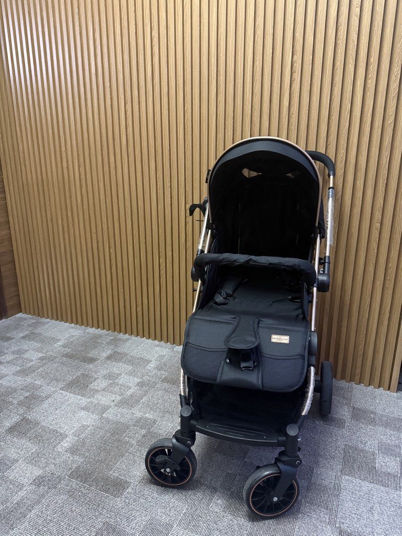 Giant Carrier Stroller - Iker Black & Rose Gold (Category: Strollers) located in Angeles City. Submitted by nutella_crepe_2026 (Listing ID 1461905587, Image 1). Description: - Chic black stroller with a luxurious rose gold frame. - Includes a protective canopy and a secure safety harness. - Convenient storage basket for essentials. - Effortless maneuverability to swivel wheels. - Compact design for easy storage. - Ideal for stress-free outings wi