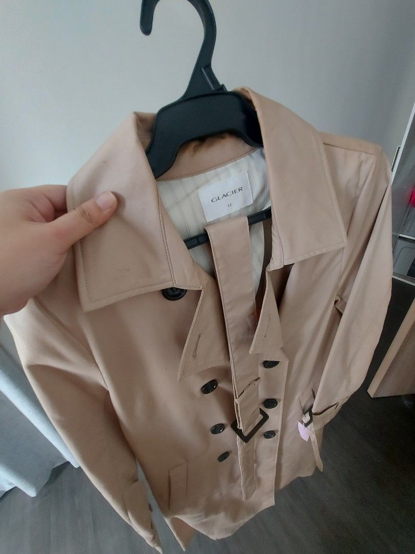 Glacier Beige Double-Breasted Trench Coat (Category: Coats, Jackets and Outerwear) located in San Pedro. Submitted by laine0728 (Listing ID 1461869644, Image 2). Description: - Classic beige trench coat from Glacier - Double-breasted design - Includes a belt to cinch the waist - Two front pockets - Button closure - Ideal for layering over any outfit - A timeless wardrobe essential - Bought in Tokyo, Japan - Used once - Original Price Php2,700.