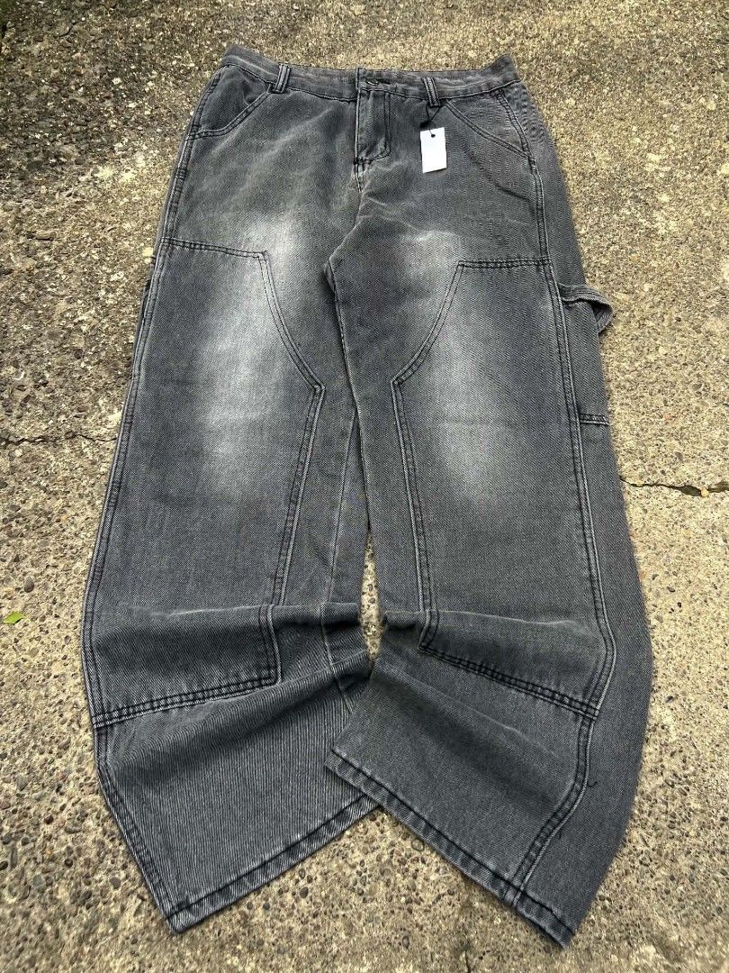 Grey Carpenter Jeans - Wide Leg (Category: Jeans) located in Manila. Submitted by tantmzn (Listing ID 1461810377, Image 1). Description: - Grey carpenter jeans - Wide leg fit - Washed-out look - Panel detailing on legs - Multiple pockets - Sturdy denim fabric - Ideal for casual streetwear style FOR SALE!! DKNEE PANTS WASH GREY WAIST 30-32 LENGTH 41 THIGH 12 LEG OPEN 9.