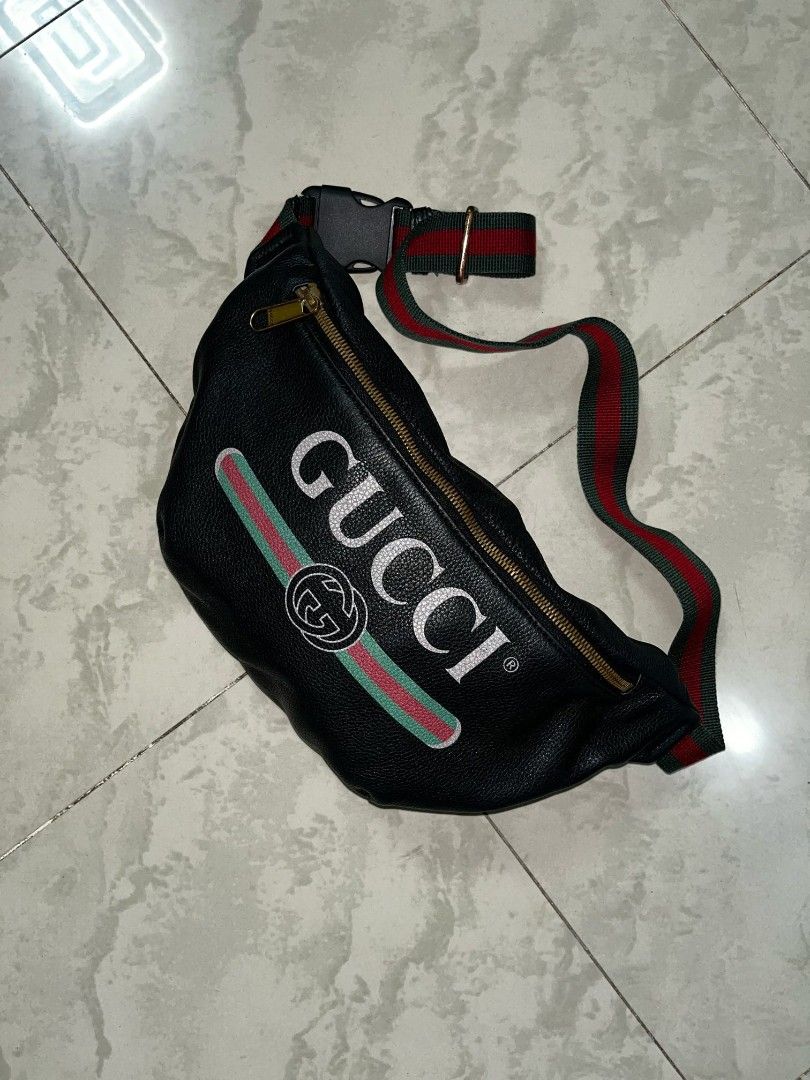 Gucci Black Leather Belt Bag (Category: Luxury Bags & Wallets) located in Manila. Submitted by bognalosjo69319 (Listing ID 1461888620, Image 2). Description: - Authentic Gucci belt bag - Material: Black leather - Iconic green and red stripe detail - Gold-tone zipper with Gucci logo - Adjustable strap with buckle closure - Perfect for carrying essentials hands-free - Made in Italy.