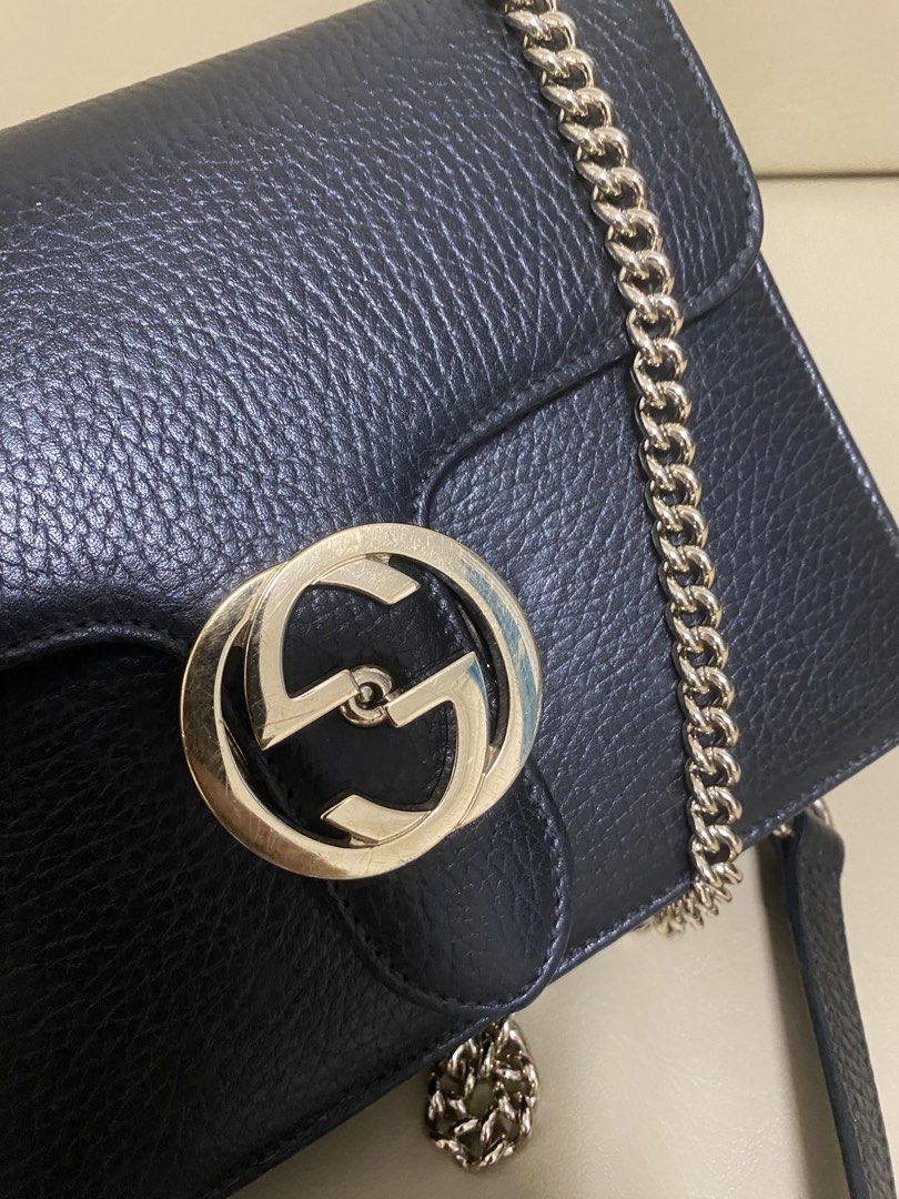 Gucci Black Leather Interlocking Chain Cross-body Bag (Category: Luxury Bags & Wallets) located in Manila. Submitted by aikara683 (Listing ID 1461977965, Image 3). Description: - Authentic Black Leather Gucci Marmont Bag - Iconic Gold GG Logo Hardware - Versatile Chain Strap - Serial Number clearly visible inside.