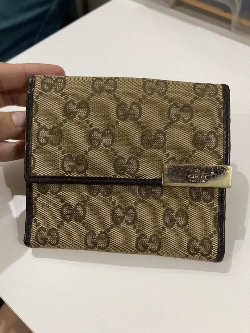 Gucci GG Monogram Canvas Bi-fold Wallet (Category: Luxury Bags & Wallets) located in Valenzuela. Submitted by dai.sukii (Listing ID 1461980724, Image 1). Description: Authentic Gucci GG monogram wallet. Brown leather trim, bi-fold with card slots & coin pocket. Minor wear on hardware/edges. Made in Italy. bought in Japan. Authentic Guaranteed negotiable.