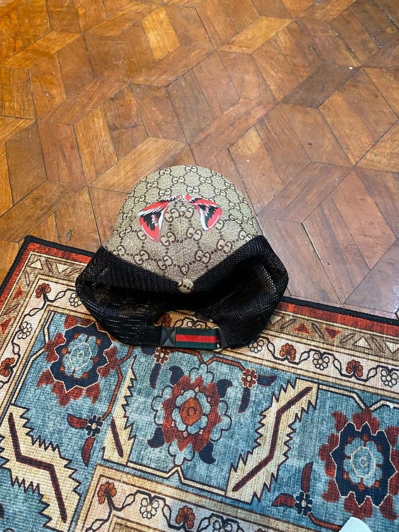 Gucci GG Supreme Monogram Fox Head Trucker Cap (Category: Caps & Hats) located in Pasig City. Submitted by paulclzdo (Listing ID 1461918667, Image 2). Description: - Iconic Gucci GG monogram pattern all over - Unique fox head graphic on the front - Breathable black mesh back - Adjustable strap for a custom fit - Ideal for everyday casual wear - Includes Gucci tag for authenticity.