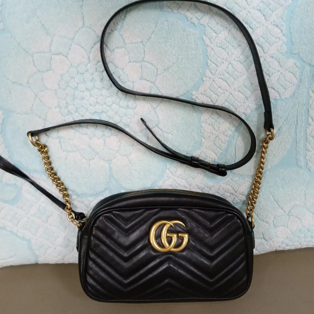 Gucci Marmont Black Shoulder Bag (Category: Luxury Bags & Wallets) located in Taguig. Submitted by esa.agustin (Listing ID 1461812965, Image 3). Description: Original Gucci Marmont black shoulder/sling bag. With inclusions. Made in Italy..
