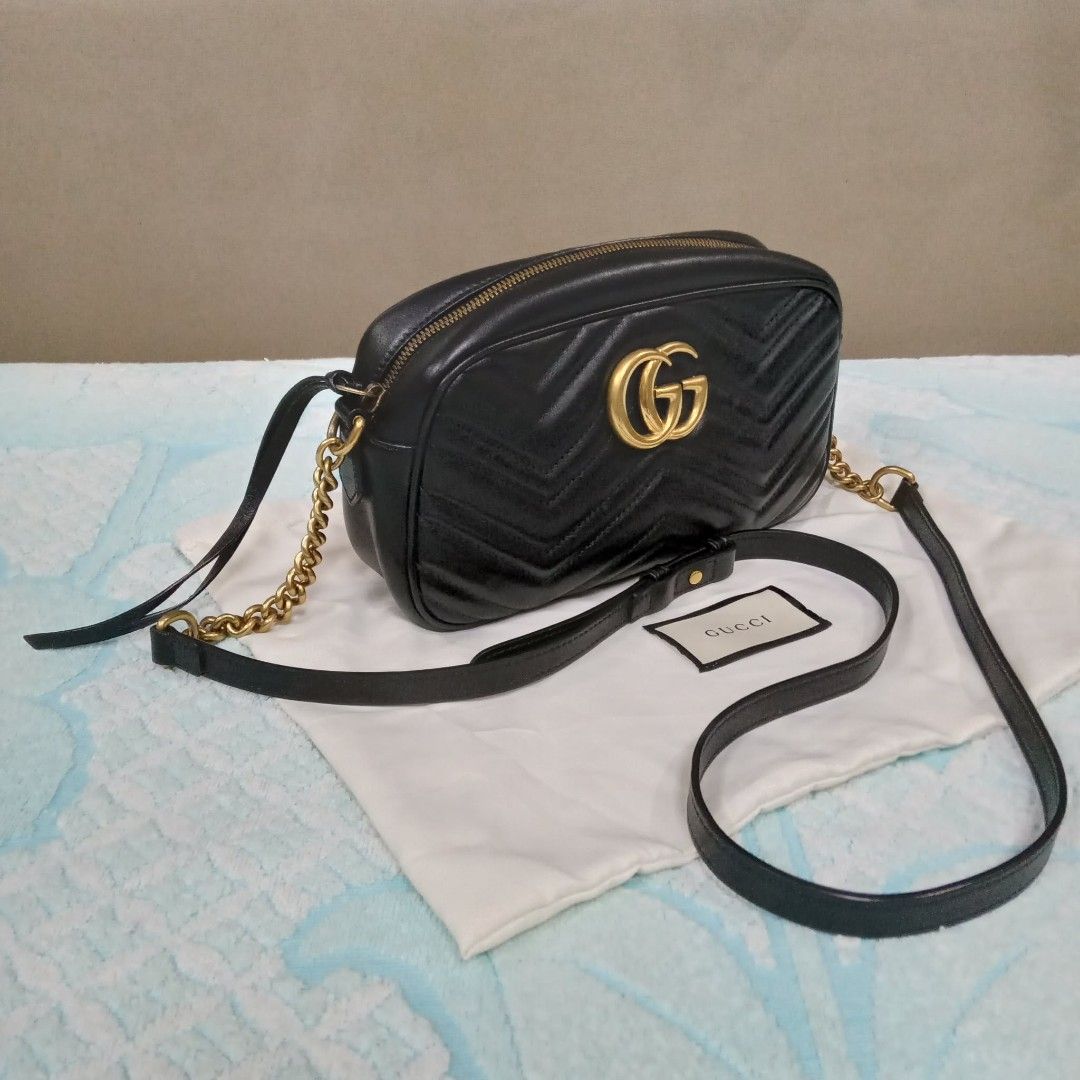 Gucci Marmont Black Shoulder Bag (Category: Luxury Bags & Wallets) located in Taguig. Submitted by esa.agustin (Listing ID 1461812965, Image 2). Description: Original Gucci Marmont black shoulder/sling bag. With inclusions. Made in Italy..