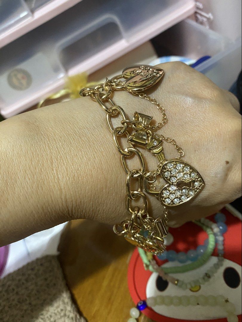 Guess Charm Bracelet (Category: Bracelets) located in Cavite. Submitted by momrocks (Listing ID 1461817436, Image 2). Description: gold-tone GUESS charm bracelet featuring dangling heart and key accents adorned with sparkling rhinestones.