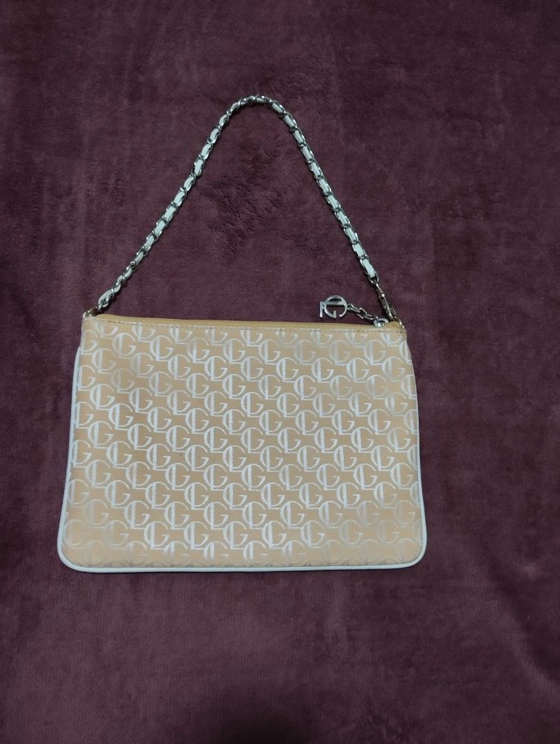 Guy Laroche Monogram Pouch Bag with Chain Strap (Category: Luxury Bags & Wallets) located in Mabalacat. Submitted by uniqlover (Listing ID 1461957667, Image 2). Description: - Authentic Guy Laroche pouch bag - Features signature all-over monogram pattern - Comes with a chic silver-tone chain strap - Interior lining also branded with Guy Laroche logo - Ideal for carrying your daily essentials.