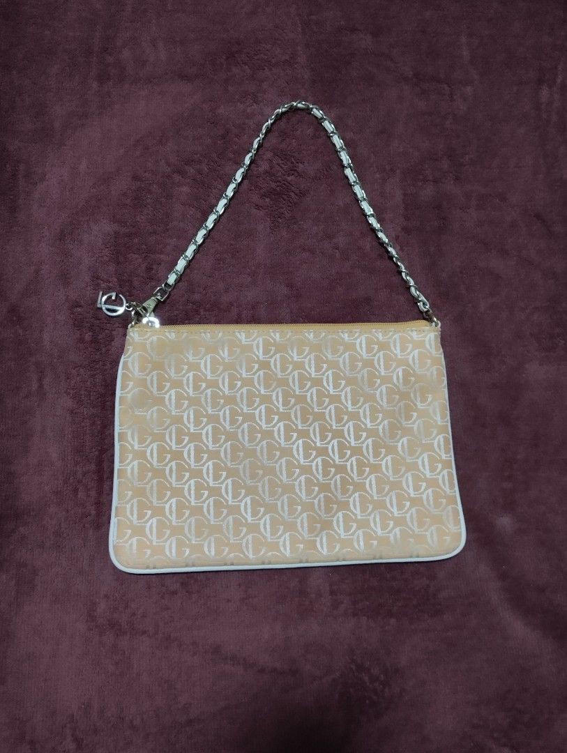 Guy Laroche Monogram Pouch Bag with Chain Strap (Category: Luxury Bags & Wallets) located in Mabalacat. Submitted by uniqlover (Listing ID 1461957667, Image 1). Description: - Authentic Guy Laroche pouch bag - Features signature all-over monogram pattern - Comes with a chic silver-tone chain strap - Interior lining also branded with Guy Laroche logo - Ideal for carrying your daily essentials.