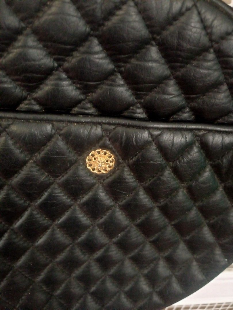 HANAMISUCO Quilted Round Shoulder Bag (Category: Luxury Bags & Wallets) located in Manila. Submitted by thepartypeopleph (Listing ID 1461869623, Image 3). Description: - Unique black quilted round shoulder/hand bag - Features a stylish gold-tone button on the front pocket - Secure zipper closure with branded HANAMISUCO pull - Adjustable shoulder strap for comfortable wear - Perfect for adding a touch of unique style to your everyday outfits in gr