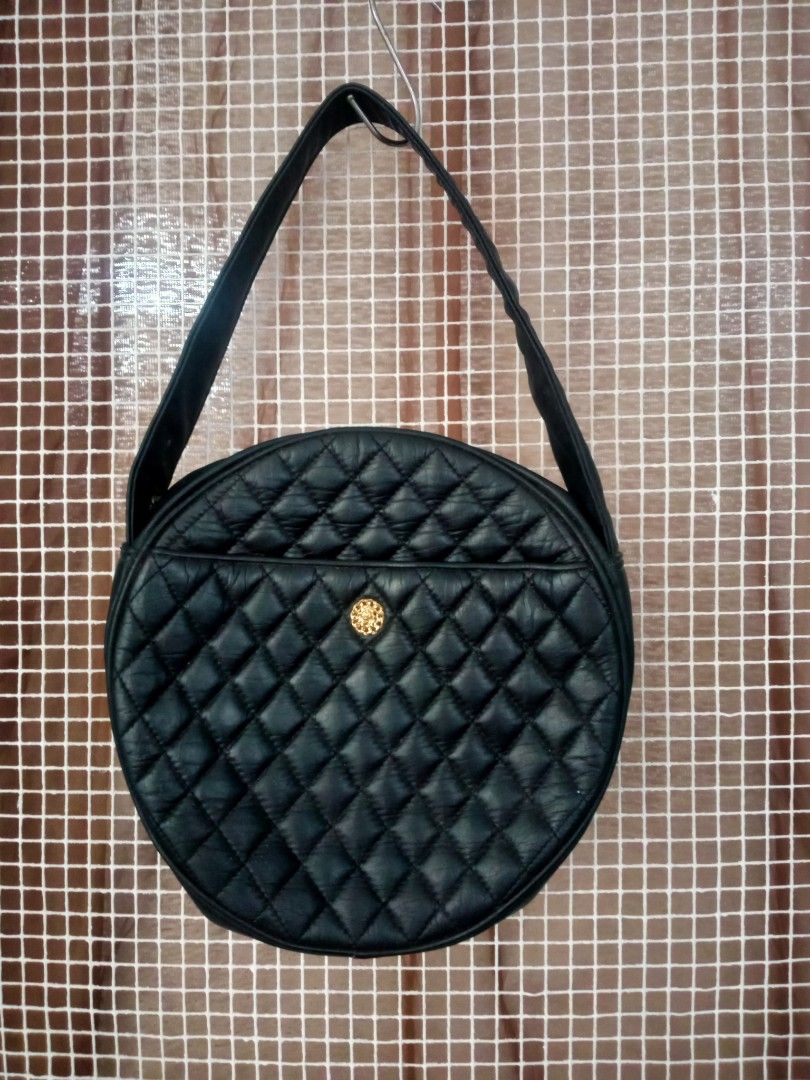 HANAMISUCO Quilted Round Shoulder Bag (Category: Luxury Bags & Wallets) located in Manila. Submitted by thepartypeopleph (Listing ID 1461869623, Image 1). Description: - Unique black quilted round shoulder/hand bag - Features a stylish gold-tone button on the front pocket - Secure zipper closure with branded HANAMISUCO pull - Adjustable shoulder strap for comfortable wear - Perfect for adding a touch of unique style to your everyday outfits in gr