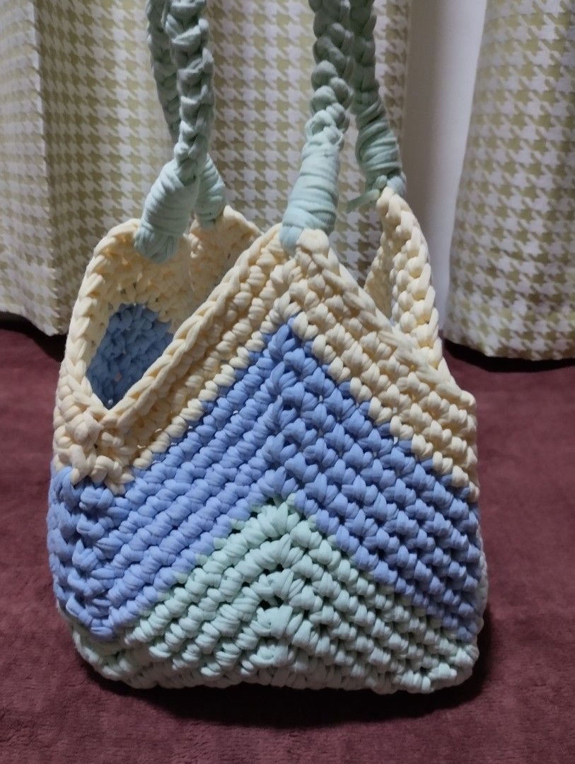 Handmade Crochet Tote Bag (Category: Tote Bags) located in Mabalacat. Submitted by uniqlover (Listing ID 1461957016, Image 3). Description: - Cute handmade crochet tote bag - Features a stylish chevron pattern - Colors: Pastel blue, mint green, and cream - Braided mint green handles - Ideal for carrying your daily essentials - Unique and fashionable design.