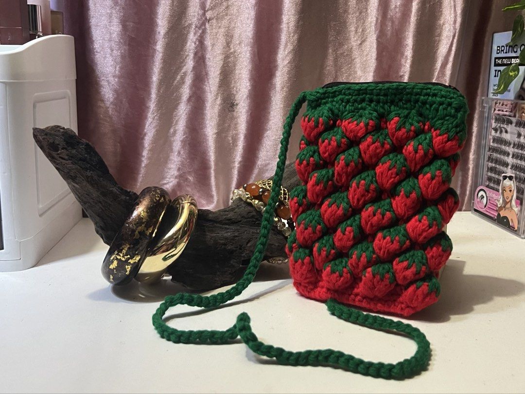 Handmade Strawberry Crochet Bag with Strap (Category: Beach Bags) located in Rizal. Submitted by evermourn777 (Listing ID 1461974818, Image 1). Description: - adorable handmade crochet phone bag - features a long green strap - zipper closure .