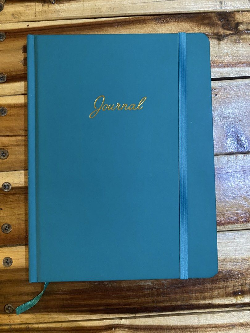 Hardbound Notebook Journal (Buy 1 take 1) (Category: Stationery & School Supplies) located in Cavite. Submitted by momrocks (Listing ID 1461823309, Image 2). Description: Brown and teal colored cover Smooth, hardbound cover Features Vertical elastic band on the right side for closure. Matching ribbon bookmark attached at the bottom..