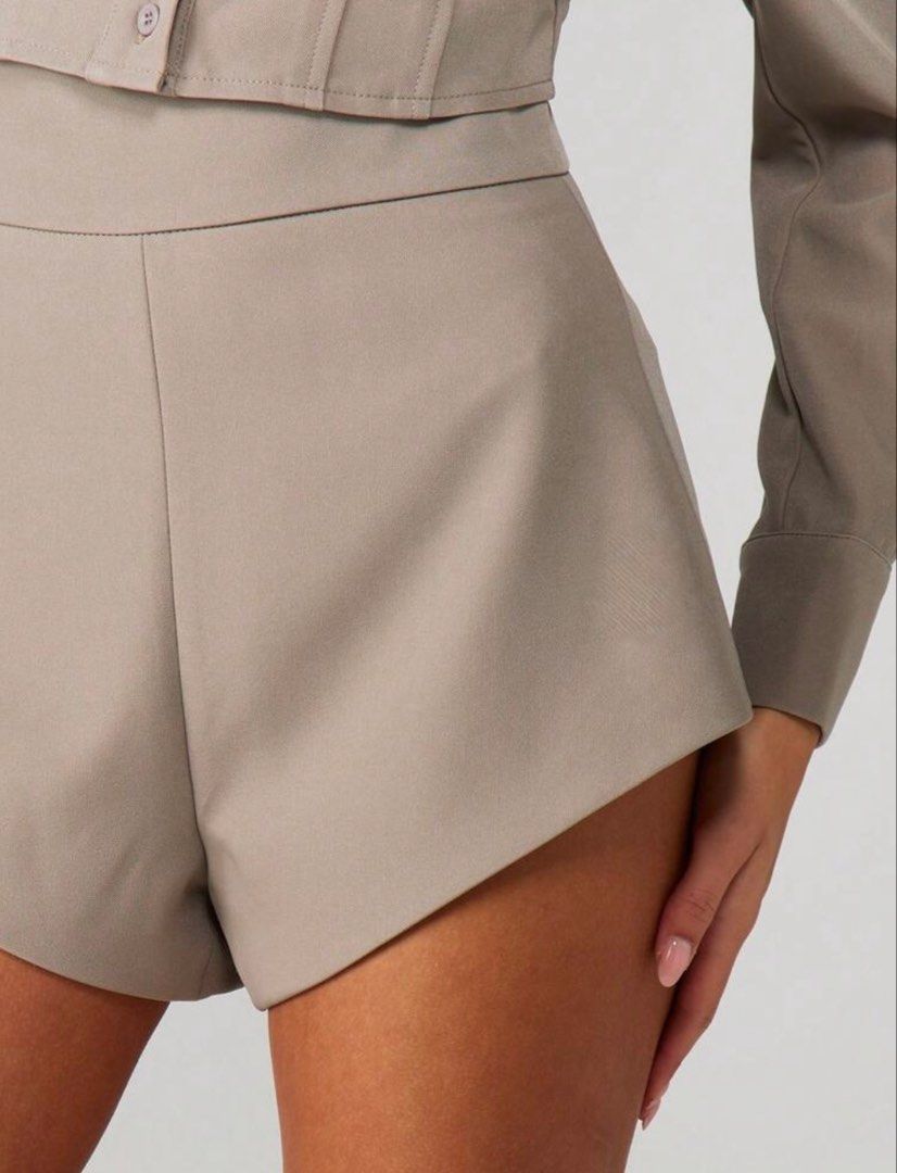 High Waisted Tailored Shorts Taupe (Category: Shorts) located in Villasis. Submitted by juliaxgamboa (Listing ID 1461883505, Image 3). Description: - High-waisted taupe shorts - Tailored fit for a flattering silhouette - Unique asymmetrical hemline - Made from structured fabric - Perfect for dressing up or down - Pairs well with boots or heels.