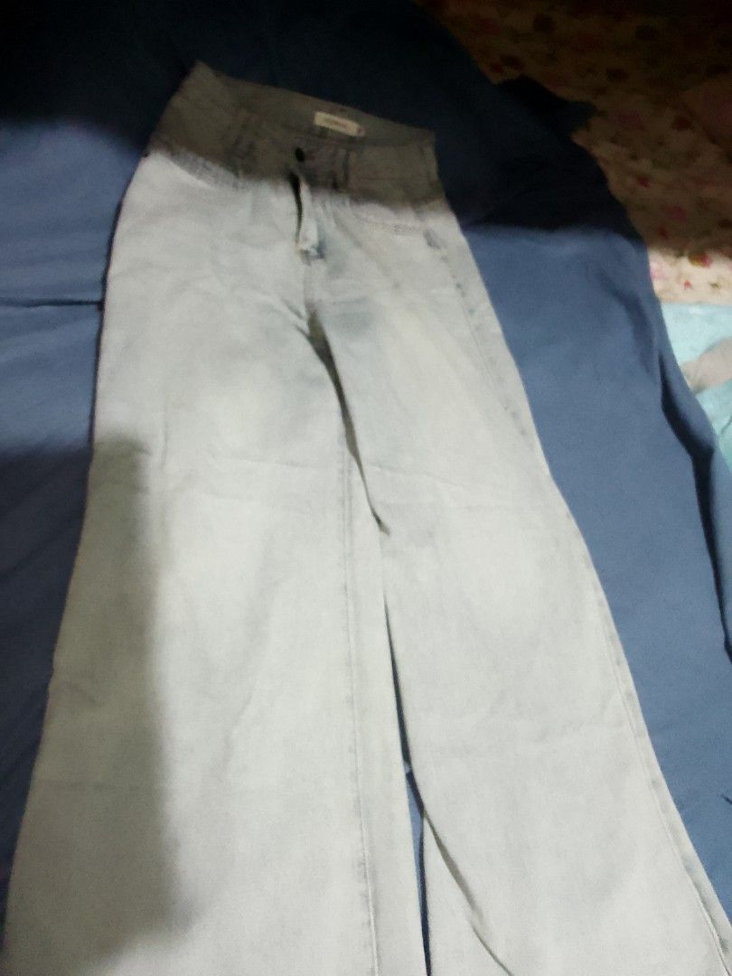 High Waisted Wide Leg Jeans (Category: Jeans) located in Quezon City. Submitted by qwertyasdf1591 (Listing ID 1461972168, Image 1). Description: - Light wash wide leg jeans - High waisted fit - Contrasting darker wash on the top part - Button and zip closure - Functional front and back pockets - Ideal for casual outfits.