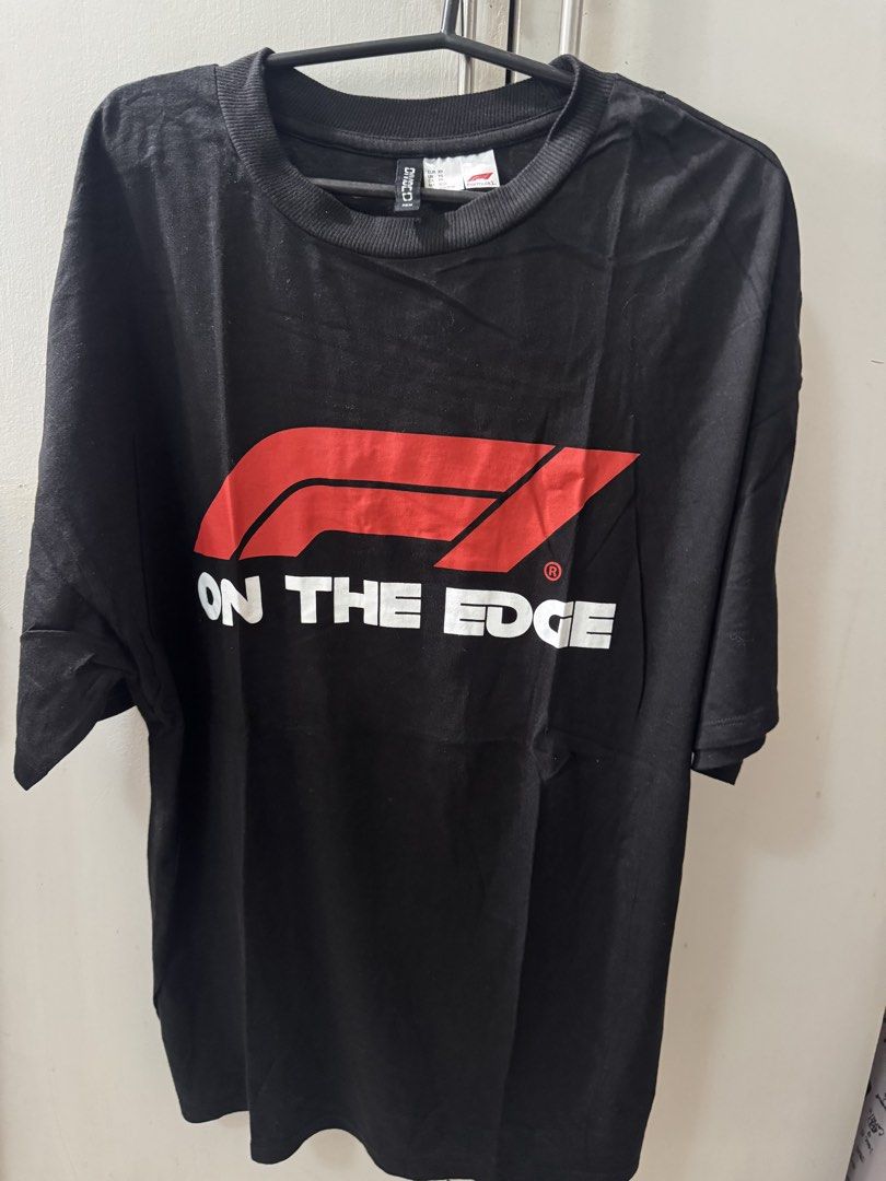 H&M Divided Formula 1 "On The Edge" Oversized Tee XS (Fits Medium) (Category: Shirts) located in Taguig. Submitted by jdeclutterist (Listing ID 1461983584, Image 1). Description: H&M Divided (Authentic Formula 1 Collab) - XS on tag but Oversized fit, parang Medium and sukat kaya maluwag talaga - 9.5/10 Once worn, no stains, no lint, and completely black (hindi kupas) - Bold Logo font graphic. Perfect for F1 girlies who love oversized streetwear l