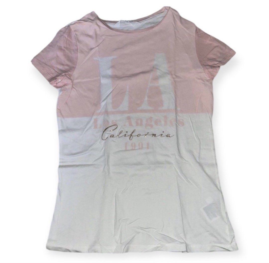 H&M Pink LA Tshirt 12-14yo (Category: Babies & Kids Fashion) located in Rizal. Submitted by cassappl (Listing ID 1461799740, Image 1). Description: - Cute LA California graphic tee - Ombre effect: Pink to white - Short sleeves - Crew neck - Ideal for casual wear - Pairs well with jeans or shorts.