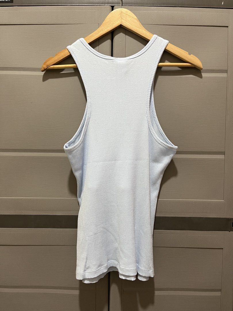 H&M Ribbed Tank Top Light Blue (Category: Sleeveless) located in Koronadal. Submitted by declutterprelovednitine_ey (Listing ID 1461808837, Image 2). Description: - Light blue ribbed tank top from H&M - Made with soft modal and stretchy elastane for ultimate comfort - Stylish racerback design - Features a small, subtle mark on the back(refer to the last photo for details) - Versatile piece: great for layering or wearing solo.