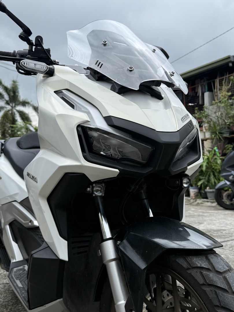 Honda ADV160 Scooter - White (Category: Motorbikes for Sale) located in Bacoor. Submitted by bernardjustine (Listing ID 1461805981, Image 2). Description: ‼️FOR SALE‼️ Honda ADV 160 2023 model * 16k plus original odo * Registered until 2028 * Original LTO Plate number * All stock engine * No history of accident * Fresh and well maintained! * Newly change engine oil and gear oil * Newly cleaned CVT * New spark plug * New air filter * Makinis pwede