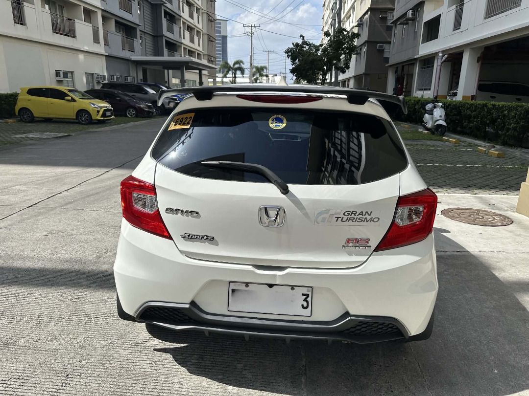 Honda Brio (Category: Used Cars) located in Las Pinas. Submitted by appthere (Listing ID 1461828922, Image 2). Description: 2021 Honda Brio 1.2 V CVT (Tafeta White) is a practical, fuel-efficient mini hatchback powered by a 1.2-liter 4-cylinder i-VTEC engine mated to a Continuously Variable Transmission (CVT). - First owner - with Rear Top Spoiler - with Rear Bottom Spoiler - with Dashcam .