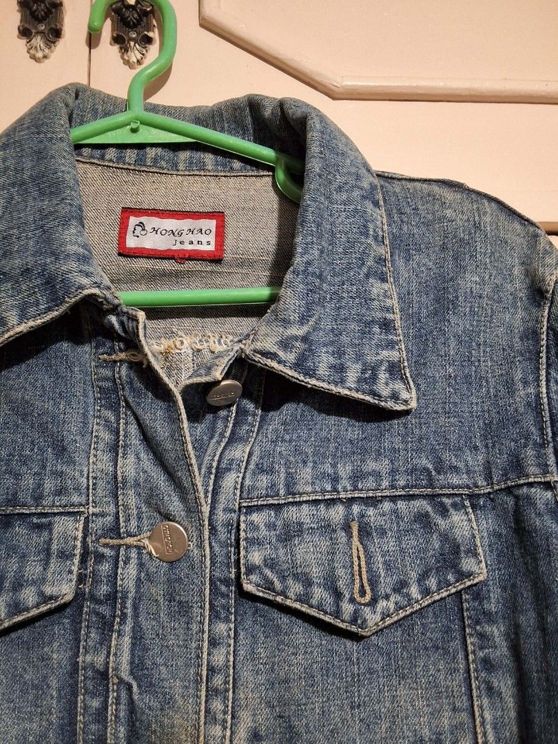 Honghao Jeans Blue Cropped Denim Jacket (Category: Coats, Jackets and Outerwear) located in Pasay City. Submitted by sandydurolfo (Listing ID 1461841821, Image 2). Description: Size: Small Style: Cropped Trucker Jacket / Raw Frayed Hem • Color: Medium Wash Blue Denim • Condition: Preloved with a minor flaw (see details below) CONDITION NOTE: There is a minor stain on the front center placket (right between the middle buttons, highlighted in the l