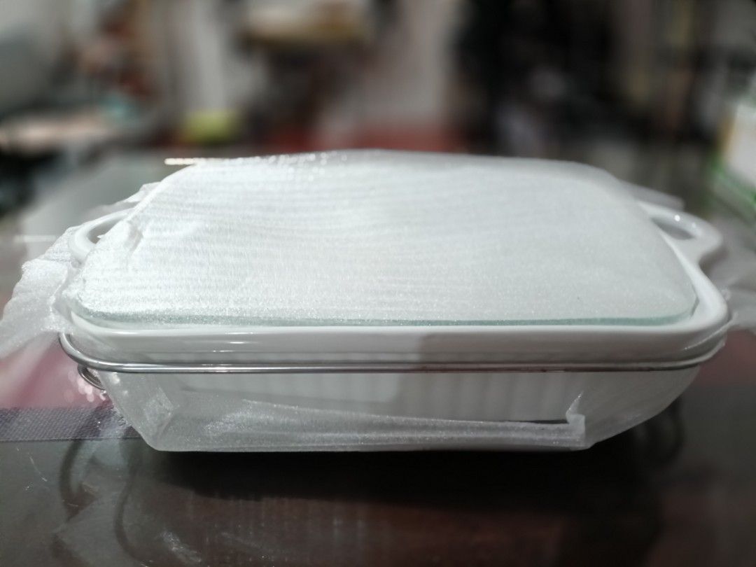 Hosh Rectangular Bake Dish with Glass Lid and Wire Rack (Category: Other Kitchenware & Tableware) located in Imus. Submitted by snapandsketch (Listing ID 1461837097, Image 2). Description: Shape : Rectangular Serving Capacity : 2 liters Body Material : ceramic With Silver-plated rack with side handles Good for baking (without the lid), plating and serving Reason for Selling : Relocation.