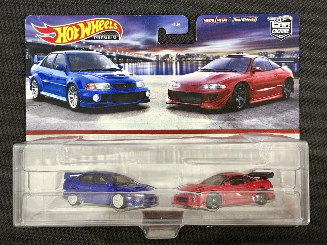 Hot Wheels Premium Mitsubishi 2-Car Set (Category: Vehicle & Diecast Models) located in Muntinlupa City. Submitted by eman_garcia_ (Listing ID 1462032348, Image 1). Description: - Hot Wheels Car Culture Premium 2-car set - Includes: Blue Mitsubishi Lancer Evolution VI & Red Mitsubishi Eclipse - Features Real Riders wheels on both cars - Brand new, in original packaging - Ideal for collectors.