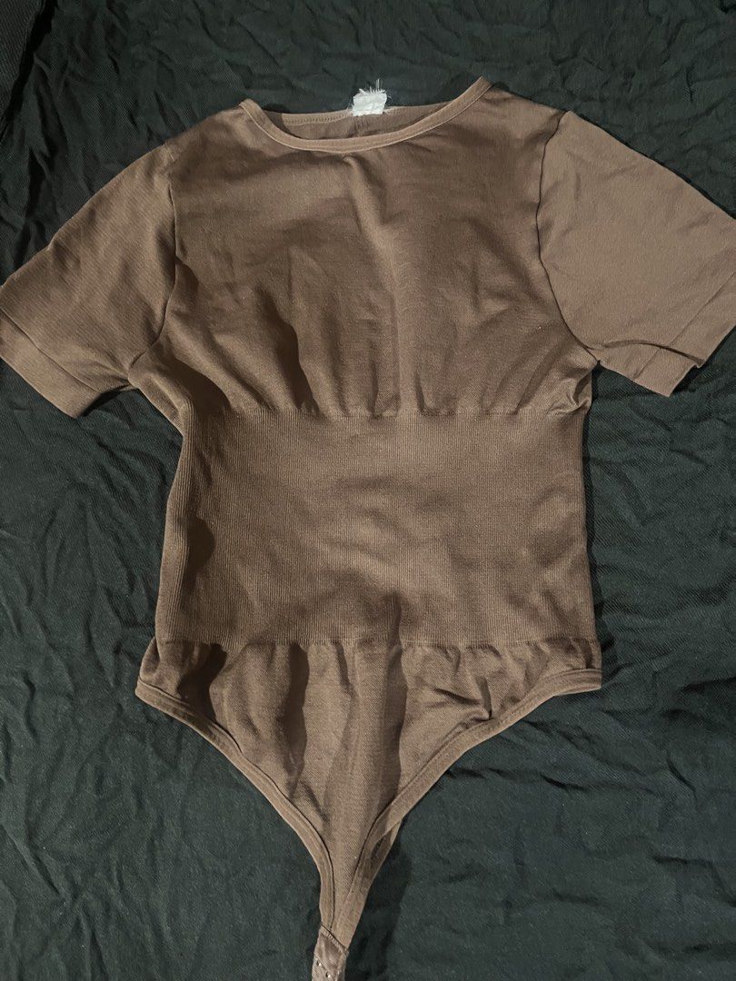 Hottie Diary Brown Bodysuit (Category: Others Tops) located in Quezon City. Submitted by anjigurl007 (Listing ID 1461905970, Image 1). Description: - HOTTIE DIARY BROWN BODYSUIT - M-L - Bought from tiktok shop Brown short sleeve bodysuit - Ribbed texture around the waist for shaping - Convenient snap closure at the bottom - Comfortable and versatile - Ideal for layering or wearing on its own.