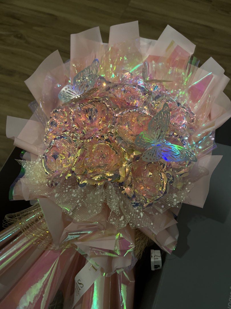 Iridescent Rose Bouquet with Butterflies (Category: Flowers & Bouquets) located in Paranaque City. Submitted by greatfinds_25 (Listing ID 1461916732, Image 3). Description: Original price: 1950 in Made by Sibol Bought this from In great condition, no broken roses; no damages on wrapper. fairy lights are dim / close to losing battery/ almost not working.