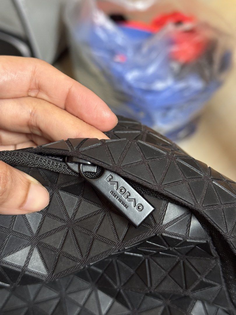 Issey Miyake Bao Bao Geometric Black Backpack (Category: Backpacks) located in Quezon City. Submitted by arc.robi (Listing ID 1461993233, Image 3). Description: - Authentic Issey Miyake Bao Bao backpack - Color: Black - Signature geometric pattern all over - Zipper closure - Interior branded tag - Padded shoulder straps for comfort - Ideal for daily use or travel.