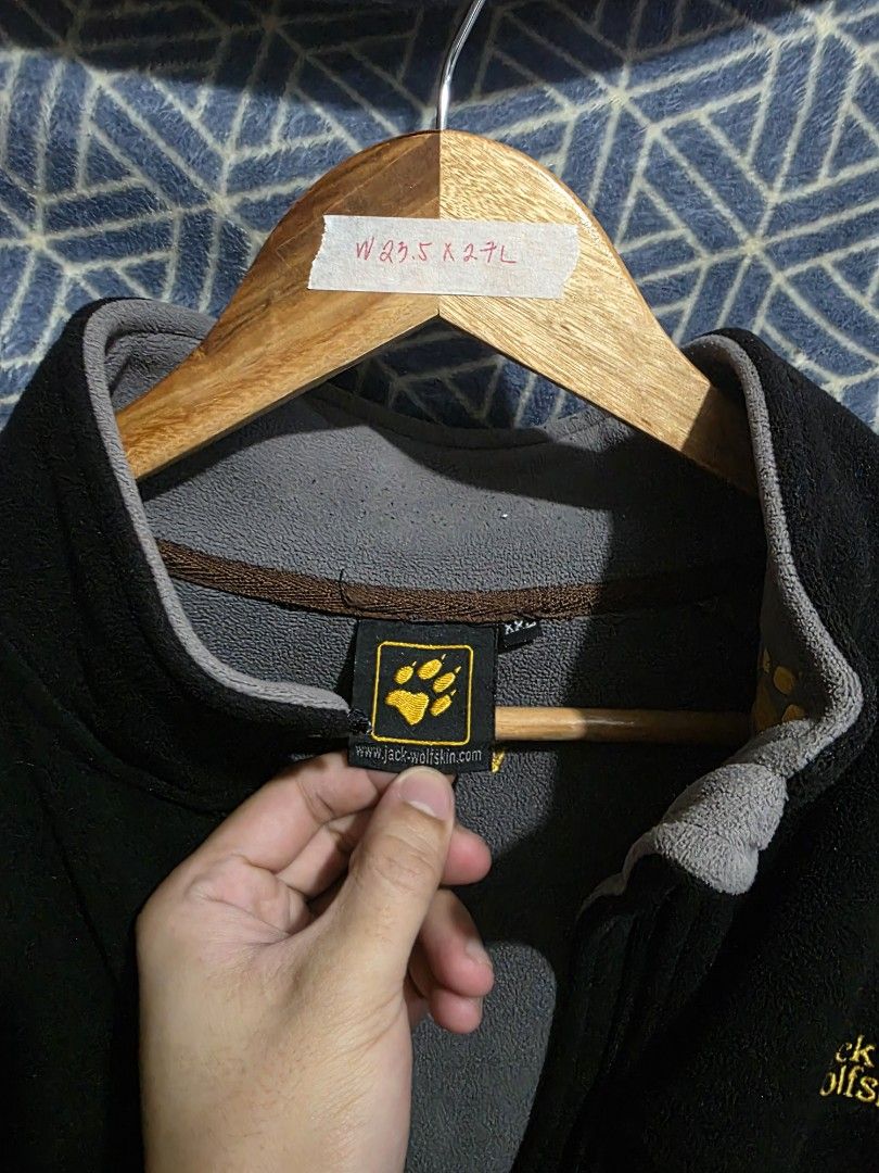 Jack Wolfskin Black Fleece Jacket for Winter (Category: Coats, Jackets and Outerwear) located in Quezon City. Submitted by kick_mnl (Listing ID 1461867377, Image 2). Description: - Brand: Jack Wolfskin - Color: Black - Style: Full zip fleece jacket - Features: 2 zip pockets, contrasting grey inside collar - Material: Soft fleece, great for layering - Use: Suitable for outdoor activities or casual wear ISSUE: zipper cannot be closed. easy replacem