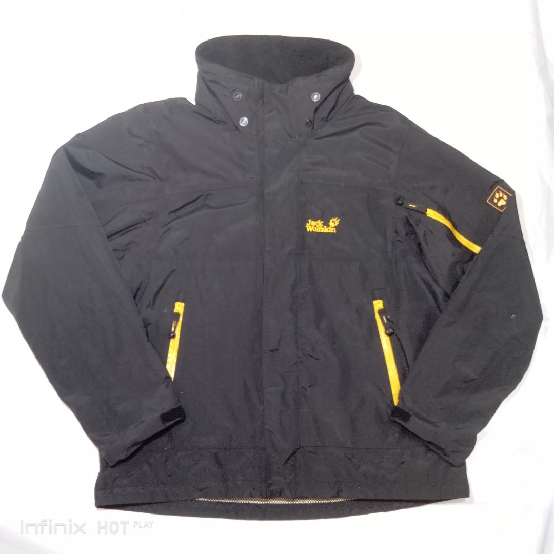 Jack Wolfskin Outdoor Black Jacket (Category: Coats, Jackets and Outerwear) located in Manila. Submitted by rhegsthrifted (Listing ID 1461972856, Image 1). Description: - 3 in 1 Weather Jacket - Black Wolfskin outdoor jacket - Features striking yellow zip details - Prominent logos on front and sleeve - Cozy inner fleece lining for extra warmth - Two external zip pockets and two internal pockets for secure storage - Adjustable cuffs for a personal