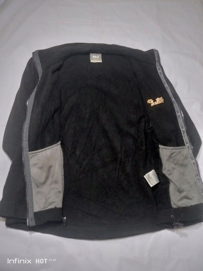 Jack Wolfskin Outdoor Black Jacket (Category: Coats, Jackets and Outerwear) located in Manila. Submitted by rhegsthrifted (Listing ID 1461972856, Image 3). Description: - 3 in 1 Weather Jacket - Black Wolfskin outdoor jacket - Features striking yellow zip details - Prominent logos on front and sleeve - Cozy inner fleece lining for extra warmth - Two external zip pockets and two internal pockets for secure storage - Adjustable cuffs for a personal