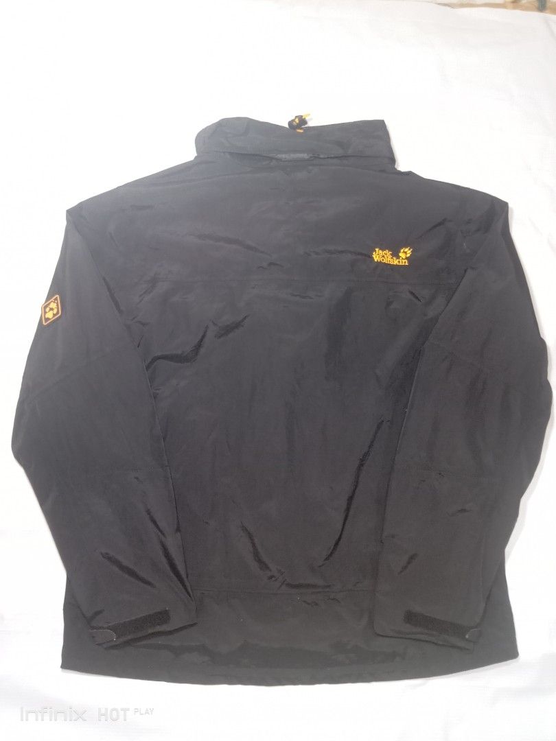 Jack Wolfskin Outdoor Black Jacket (Category: Coats, Jackets and Outerwear) located in Manila. Submitted by rhegsthrifted (Listing ID 1461972856, Image 2). Description: - 3 in 1 Weather Jacket - Black Wolfskin outdoor jacket - Features striking yellow zip details - Prominent logos on front and sleeve - Cozy inner fleece lining for extra warmth - Two external zip pockets and two internal pockets for secure storage - Adjustable cuffs for a personal